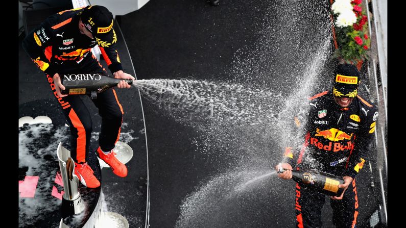Formula One driver Max Verstappen, left, sprays his Red Bull teammate, Daniel Ricciardo, after <a href="index.php?page=&url=http%3A%2F%2Fwww.cnn.com%2F2017%2F10%2F01%2Fmotorsport%2Fmalaysian-gp-verstappen-hamilton-vettel%2Findex.html" target="_blank">winning the Malaysian Grand Prix</a> on Sunday, October 1. It was Verstappen's first win of the season. Ricciardo finished in third.