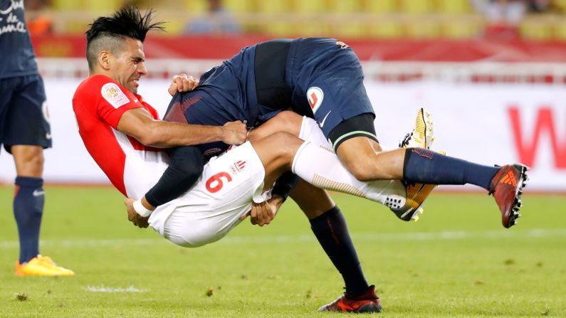 Monaco's Radamel Falcao, left, collides with Montpellier's Pedro Mendes during a French league match in Monaco on Friday, September 29.