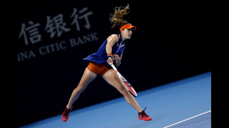 Alize Cornet serves the ball to Angelique Kerber during a China Open match in Beijing on Sunday, October 1. 