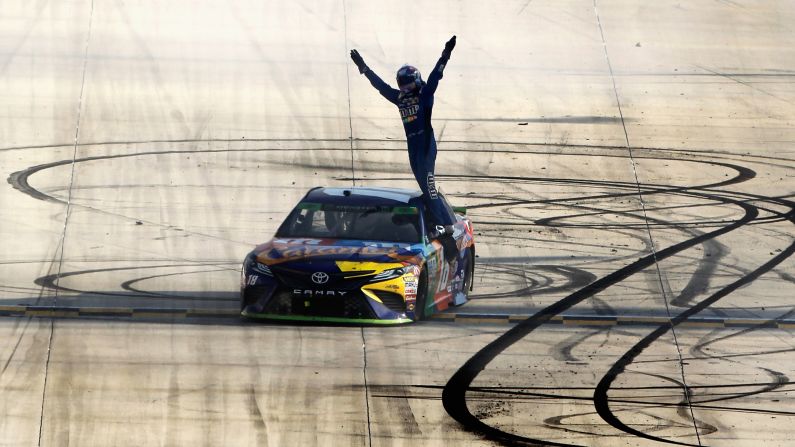 NASCAR driver Kyle Busch celebrates after winning the Cup Series race in Dover, Delaware, on Sunday, October 1. It was his second straight victory. He also won last week in New Hampshire.