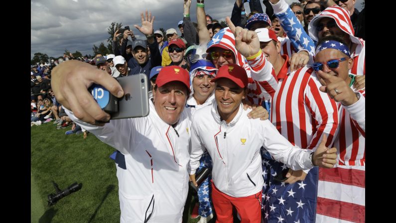 Golfer Phil Mickelson takes a selfie with fans and teammate Rickie Fowler during Presidents Cup play on Saturday, September 30. The American team continues to dominate the competition, <a href="index.php?page=&url=http%3A%2F%2Fwww.cnn.com%2F2017%2F10%2F02%2Fgolf%2Fdustin-johnson-presidents-cup-ryder-cup-phil-mickelson-steve-stricker-trump%2Findex.html" target="_blank">winning it this weekend</a> for the seventh straight time. The International Team has only won the Presidents Cup once -- in 1998.