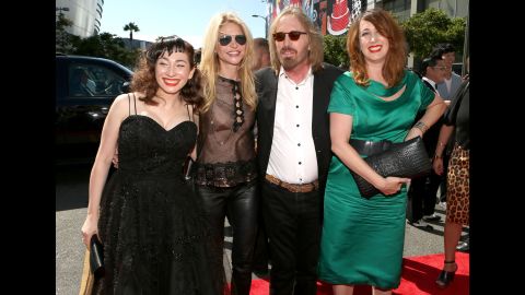 Petty, flanked by his wife, Dana, and his eldest daughter Adria on the right, arrive at the 2012 MTV Video Music Awards along with musician Regina Spektor, left.