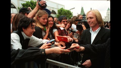 Petty signs autographs after his band got a star on the Hollywood Walk of Fame in April 1999.