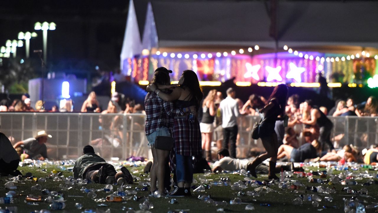 Concertgoers ran from the Route 91 Harvest country music festival on October 1, 2017 in Las Vegas, Nevada. 