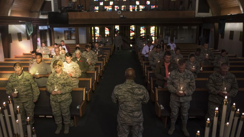 Families and airmen at Nellis Air Force Base gathered to hold vigil for the victims of the Las Vegas shooting