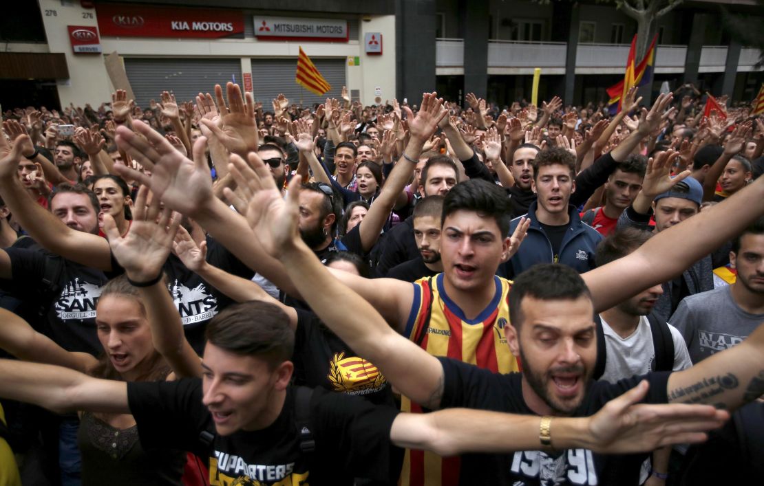 Protestors gather in front of the Spanish Partido Popular ruling party headquarters in Barcelona, Spain.