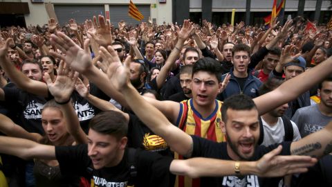 Protestors gather in front of the Spanish Partido Popular ruling party headquarters in Barcelona, Spain.
