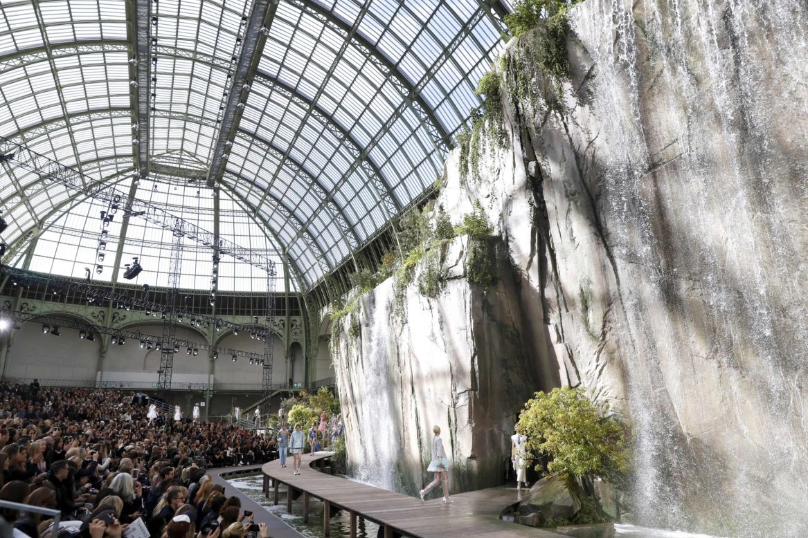 This year Karl Lagerfeld presented his collection for Chanel against a backdrop of water cascading down cliff sides in the Grand Palais. 