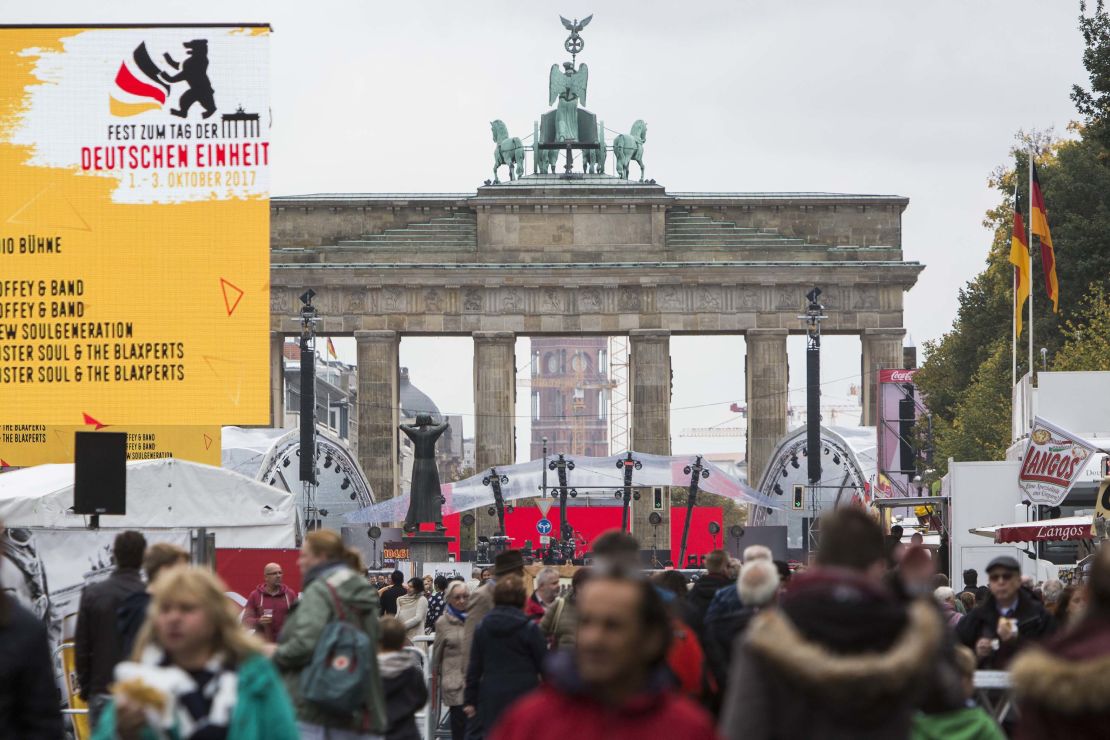 Germans celebrate the "Day of German Unity" at the Brandenburg Gate in Berlin. The monument stood in no-man's land, between East and West Berlin, until 1989.