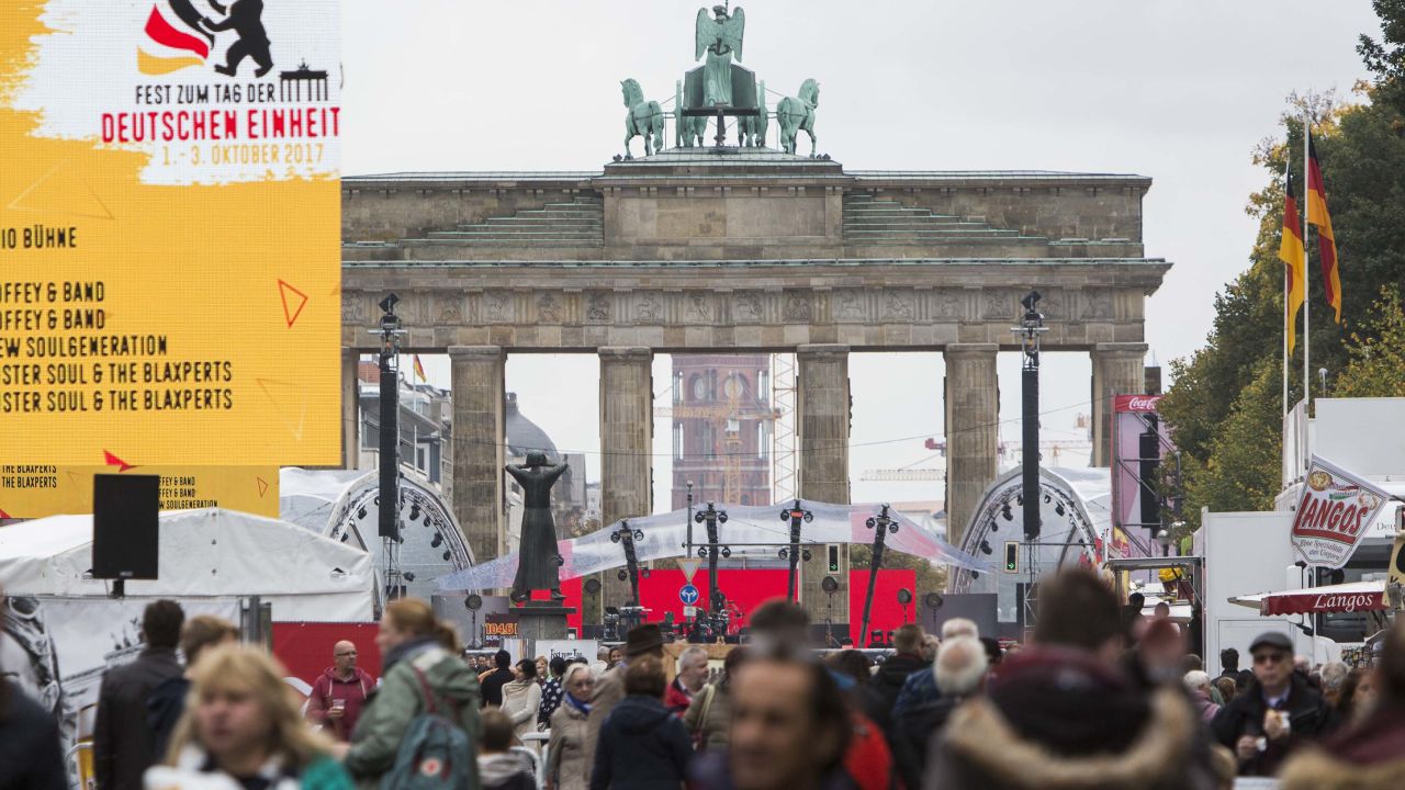 Germans celebrate the "Day of German Unity" at the Brandenburg Gate in Berlin. The monument stood in no-man's land, between East and West Berlin, until 1989.