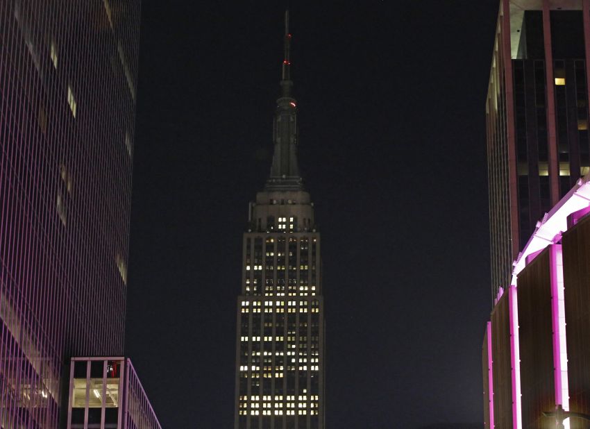 The lights of the Empire State Building are dimmed in New York on October 2.
