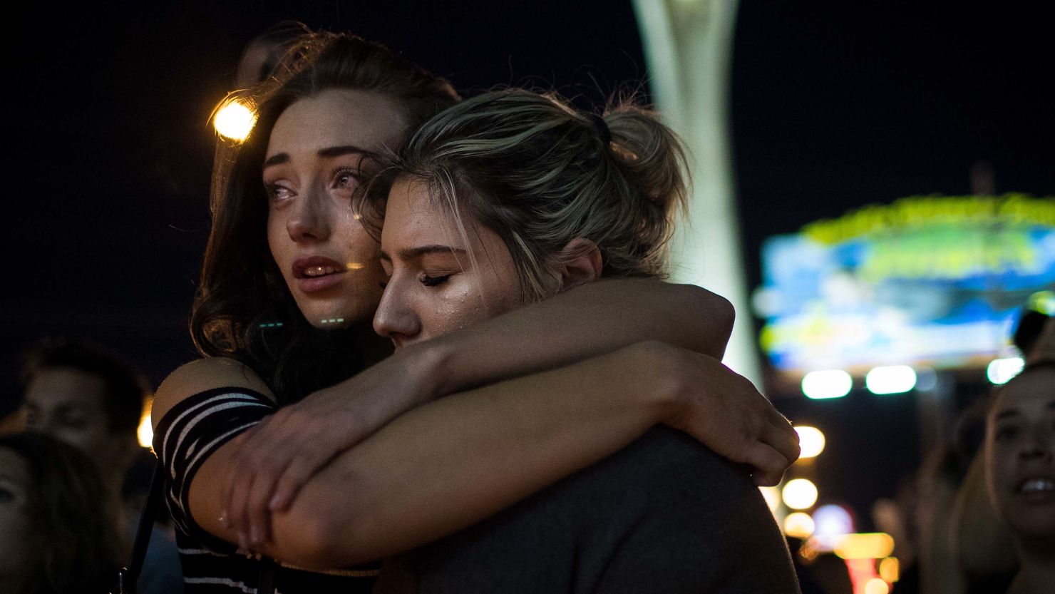 Mourners attend a candlelight vigil for the victims of the mass shooting, October 2, 2017 in Las Vegas, Nevada. 
