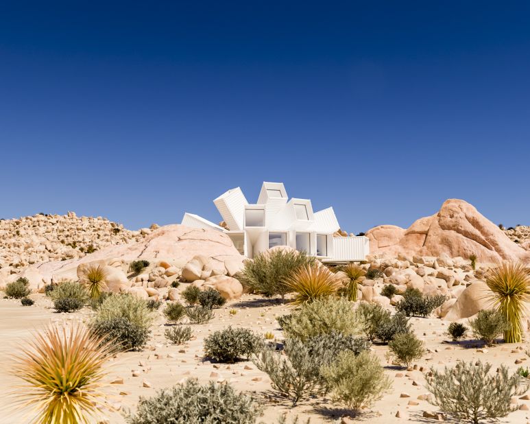 The Joshua Tree Residence is a unique home made of shipping containers that will be built in 2018 just outside the northern boundary of California's Joshua Tree National Park. These computer-generated images show an artist's impression of the expected result.