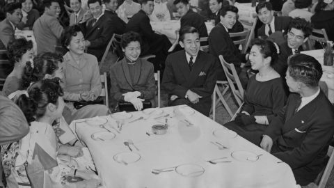 After graduating from Gakushuin University, Akihito attends a farewell party with other graduates in April 1956.