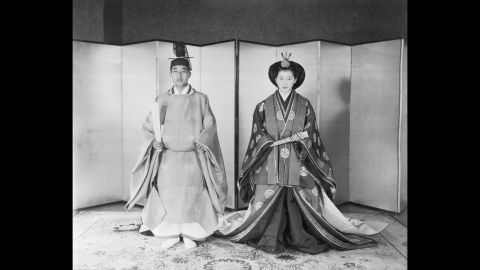 Akihito and Michiko pose in traditional Japanese wedding costumes before their marriage in April 1959.