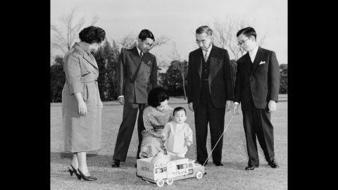 Members of the Japanese imperial family are photographed in 1961. Akihito is second from left, looking at his wife and their first son, Naruhito. They are joined by Akihito's parents, Emperor Hirohito and Empress Nagako, and his brother Masahito.
