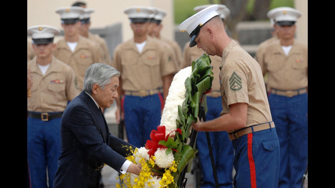 During a visit to Honolulu in 2009, Akihito lays a wreath at the National Memorial Cemetery of the Pacific. Akihito has repeatedly expressed remorse for his country's actions before and during World War II.
