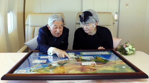 Akihito and Michiko sit together during a flight to Vietnam in February 2017.