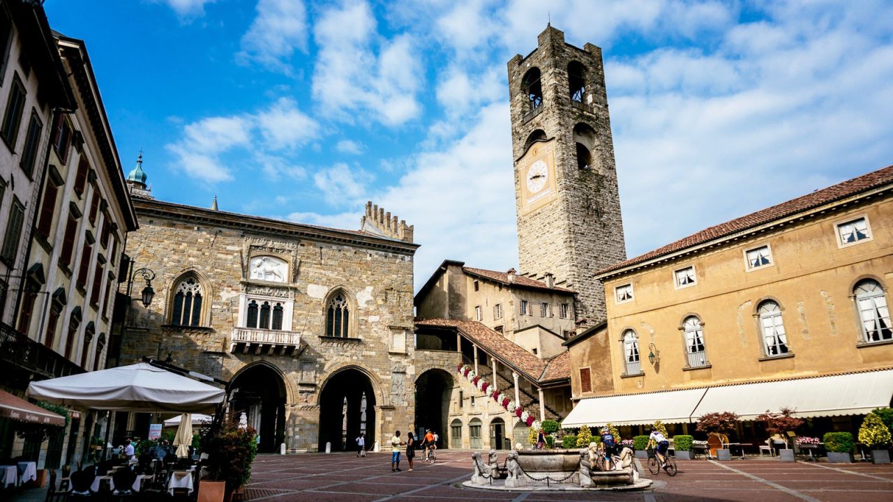 <strong>Bergamo: </strong> Piazza Vecchia, a café clad square in the center of Città Alta, is surrounded with elegant architecture such as Palazzo Nuovo and Torre del Campanone, which showcase Bergamo's storied past.<br />