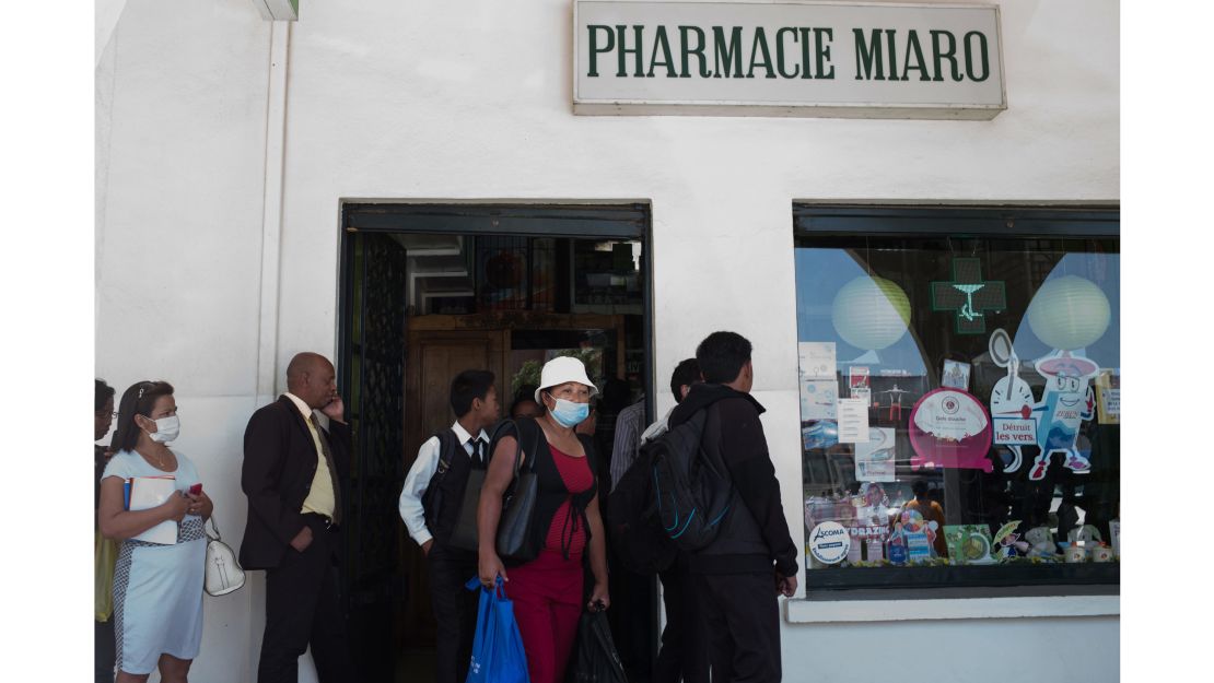 People line up at a pharmacy in downtown Antananarivo.