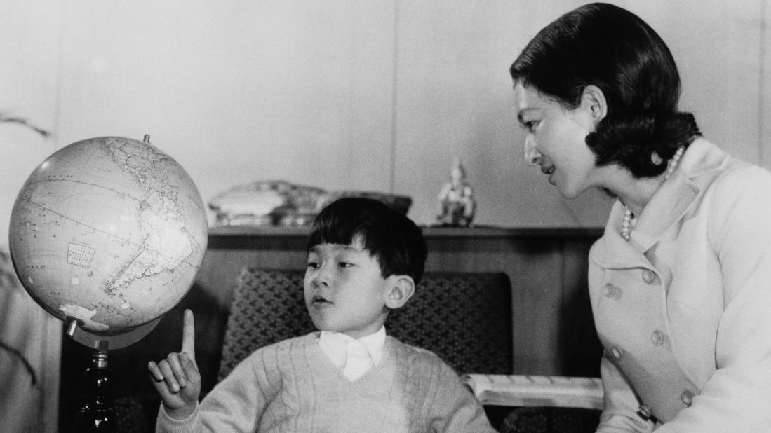 Prince Hiro, also known as Crown Prince Naruhito of Japan, studies a globe with his mother, Empress Michiko, at Togu Palace in Tokyo in February 1968. 