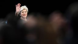 Britain's Prime Minister Theresa May waves as she takes the stage to deliver her speech on the final day of the Conservative Party annual conference at the Manchester Central Convention Centre in Manchester, northwest England, on October 4, 2017. / AFP PHOTO / Paul ELLIS        (Photo credit should read PAUL ELLIS/AFP/Getty Images)