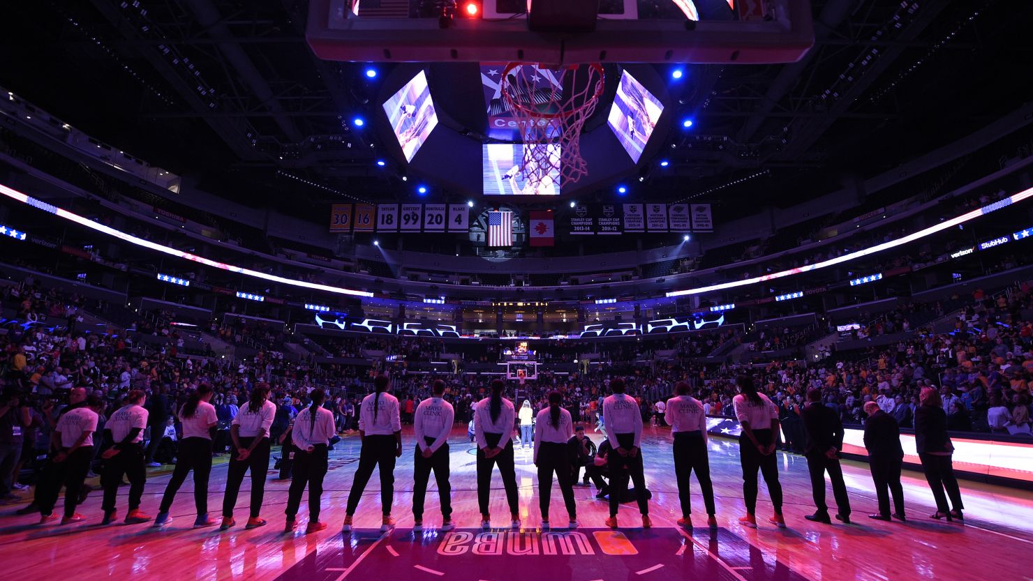 Minnesota Lynx players stand up for the National Anthem as the Los Angeles Sparks stay in their locker room during Game 3 of the WNBA Finals at Staples Center last week in Los Angeles.