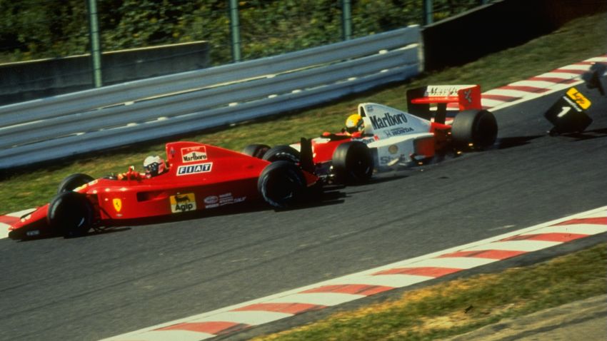 1990:  Fiat Ferrari driver Alain Prost of France and McLaren Honda driver Ayrton Senna of Brazil crash during the Japanese Grand Prix at the Suzuka circuit in Japan. \ Mandatory Credit: Allsport UK /Allsport