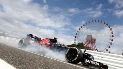 SUZUKA, JAPAN - OCTOBER 07: Carlos Sainz of Spain driving the (55) Scuderia Toro Rosso STR11 Ferrari 060/5 turbo locks a wheel as he comes into the pits during practice for the Formula One Grand Prix of Japan at Suzuka Circuit on October 7, 2016 in Suzuka.  (Photo by Clive Rose/Getty Images)