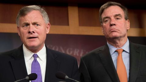Senate Intelligence Chairman Richard Burr, at left, a North Carolina Republican; and Senate Intelligence Vice Chairman Mark Warner, at right, a Virginia Democrat, hold a news conference on the status of the committee's inquiry into Russian interference in the 2016 election on Capitol Hill in Washington in October 2017. (JIM WATSON/AFP/Getty Images)