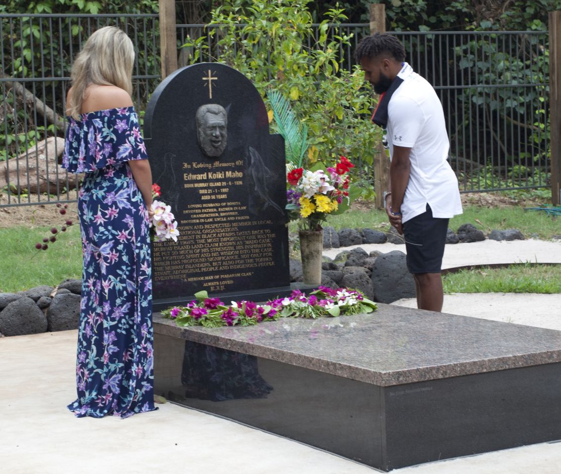 Patty Mills and his partner Alyssa Levesque visit Eddie Mabo's grave on Mer.
