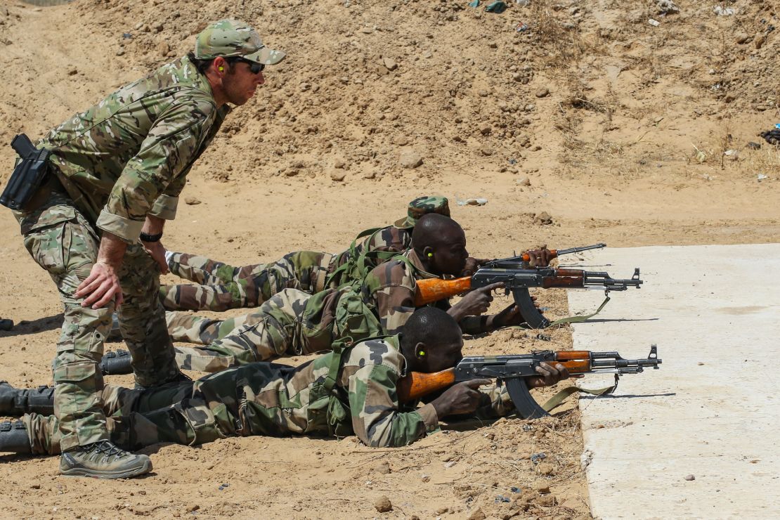 A U.S. Army Special Forces weapons sergeant observes a Niger Army soldier during marksmanship training in Diffa, Niger,  in February 2017.