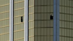 The damaged windows on the 32nd floor room that was used by the shooter in the Mandalay Hotel after a gunman killed at least 58 people and wounded more than 500 others when he opened fire on a country music concert in Las Vegas, Nevada on October 2, 2017. 
Police said the gunman, a 64-year-old local resident named as Stephen Paddock, had been killed after a SWAT team responded to reports of multiple gunfire from the 32nd floor of the Mandalay Bay, a hotel-casino next to the concert venue. / AFP PHOTO / Mark RALSTONMARK RALSTON/AFP/Getty Images