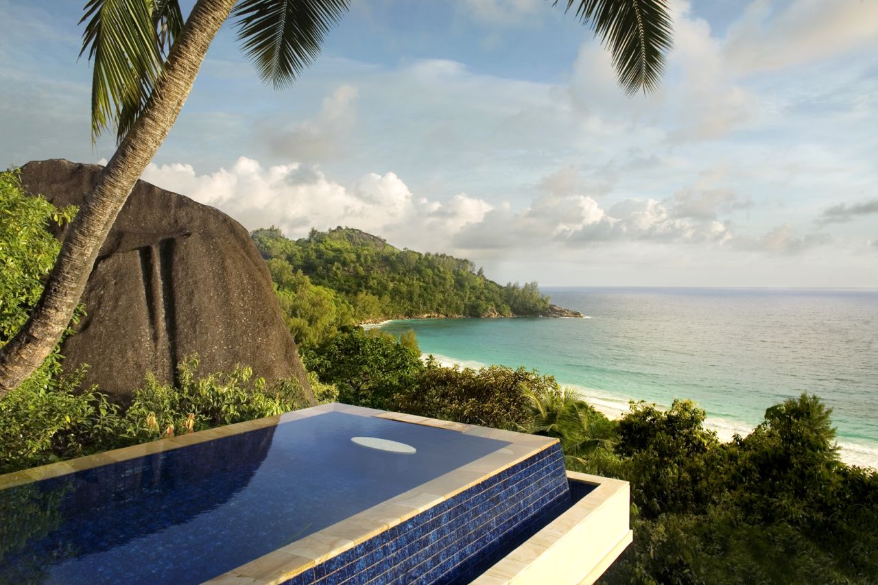 <strong>Banyan Tree Seychelles:</strong> Intendance Bay is the setting for the Banyan Tree Seychelles pool villas that overlook the Indian Ocean, with palm trees and rainforest below.