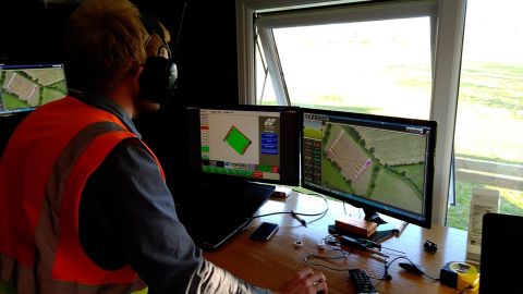 Engineer Martin Abell monitors an automated spraying operation from the control room.