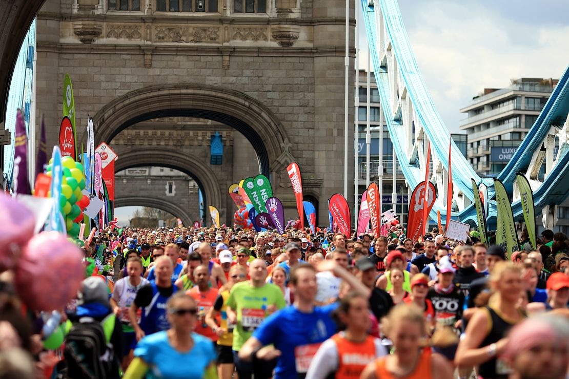 Runners cross Tower Bridge during the 2016 London Marathon.