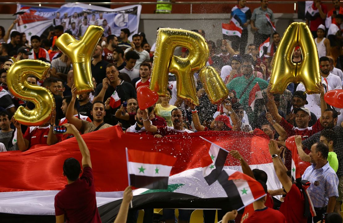Syria fans cheer on their team ahead of the World Cup qualifier against Australia.