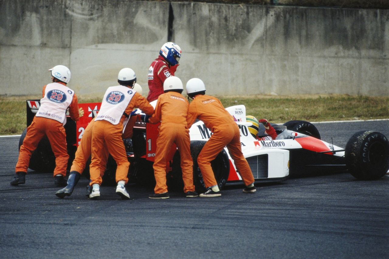 Senna (closest to the camera) managed to get going again and take the checkered flag in the race but was later disqualified for using the chicane's escape road to rejoin the circuit. The result meant Prost won the drivers' title that year. 