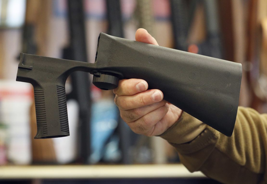 A bump stock device that fits on a semi-automatic rifle to increase the firing speed, making it similar to a fully automatic rifle, is shown here at a gun store in Salt Lake City, Utah. 
