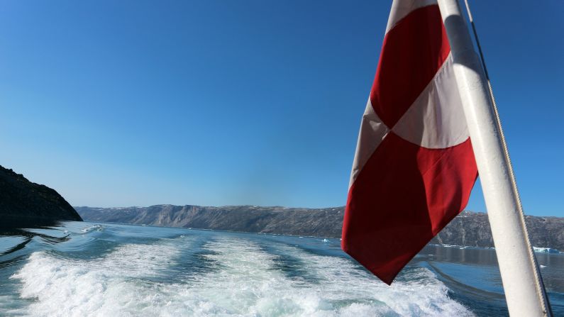 Greenland's flag represents the sun rising over a glacier in the water. Appropriate for an early morning trip to Eqi Glacier. 