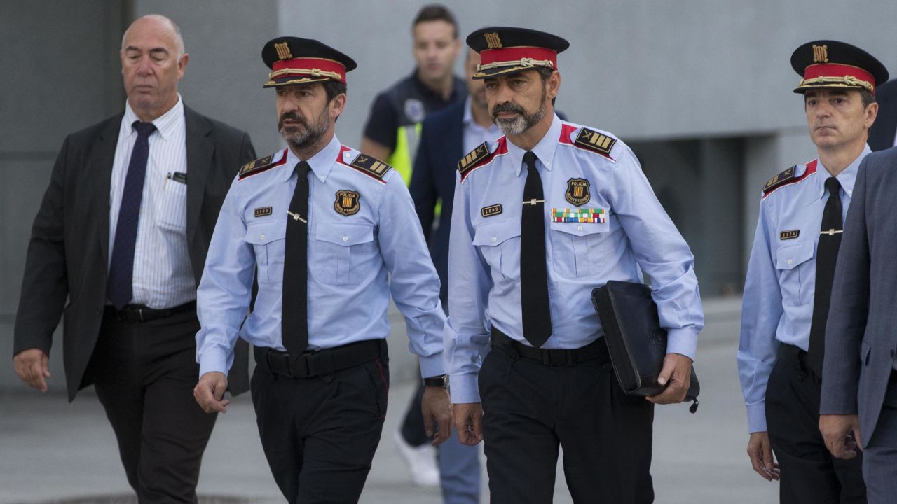 Catalan regional police chief Josep Lluis Trapero, 2nd right, arrives at the national court in Madrid on Friday.