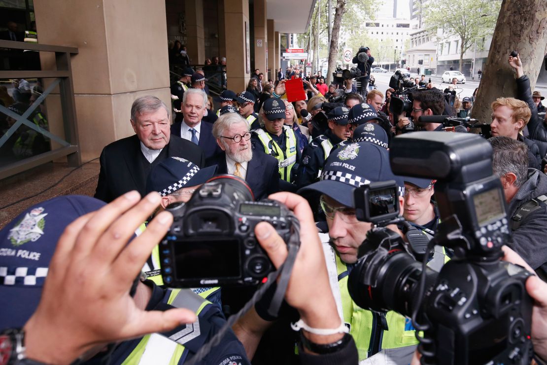 Cardinal George Pell leaves the Melbourne Magistrates' Court with a heavy Police escort on October 6 in Melbourne.