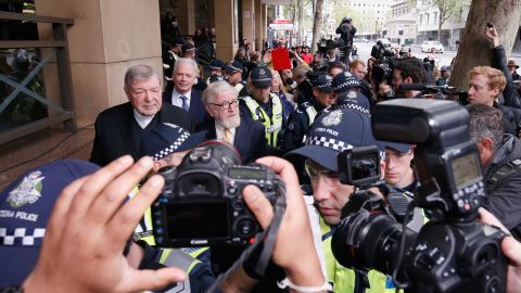 Cardinal George Pell leaves the Melbourne Magistrates' Court with a heavy Police escort on October 6 in Melbourne.