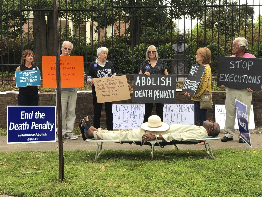 Judge Wendell Griffen lies on a cot at an anti-death penalty demonstration outside the Governor's Mansion in Little Rock, Arkansas on April 14, 2017. (Sherry Simon via AP)