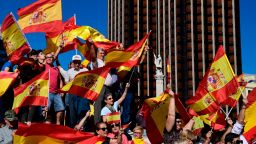 Protestors gather holding Spanish flags during a demonstration against independence of Catalonia called by DENAES foundation for the Spanish Nation Defence on October 07, 2017 in Madrid.