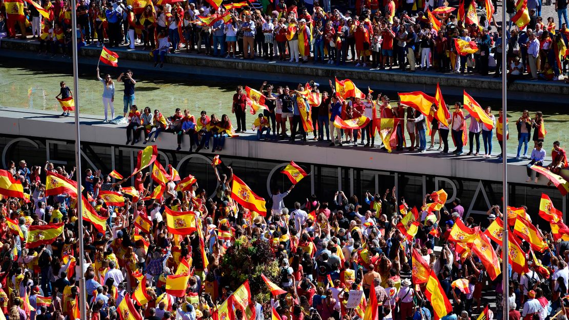 Protesters with Spanish flags gather Saturday in Madrid to demonstrate against Catalan independence.