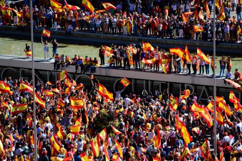 Protesters with Spanish flags gather to demonstrate against independence for Catalonia in Madrid on October 7.