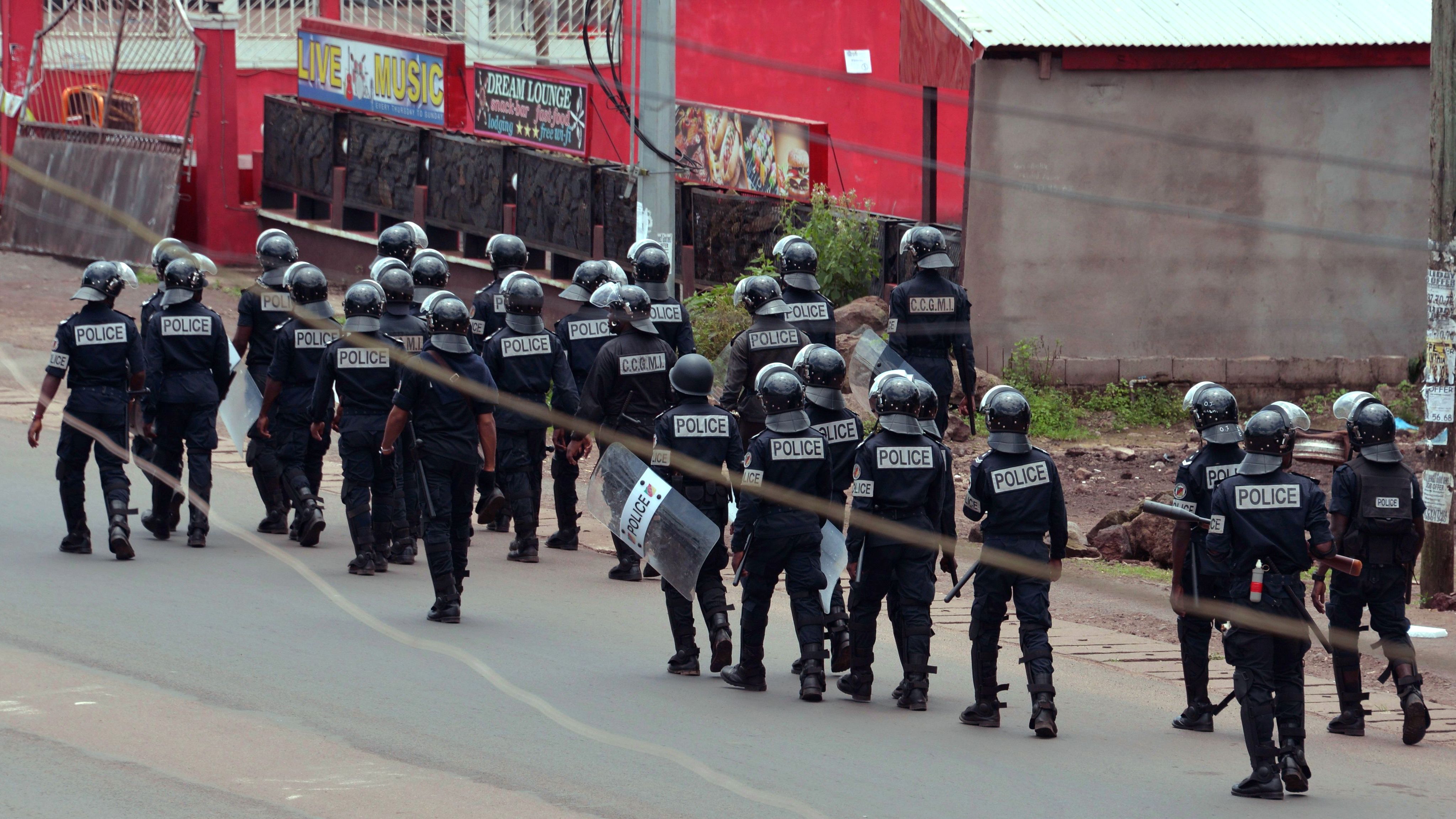 Cameroon police with riot shields patrol on a street in the administrative quarter of Buea on October 1, 2017.

