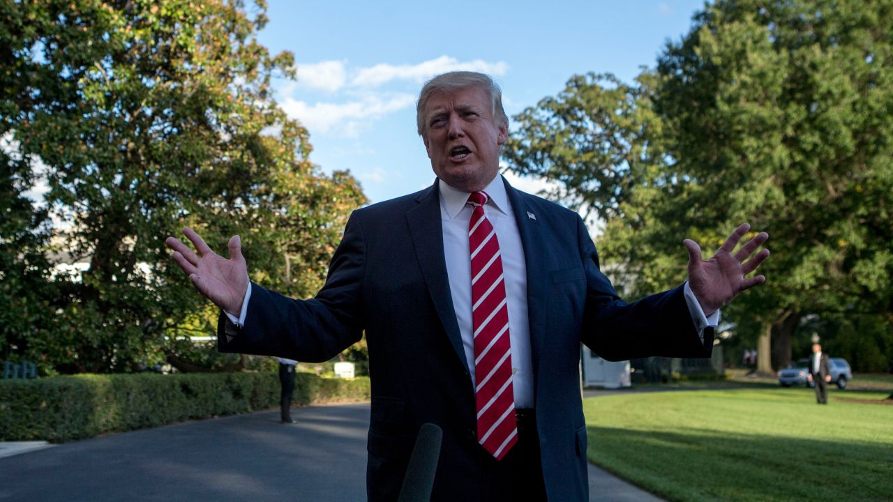 US President Donald Trump speaks with reporters outside the White House prior to his departure aboard Marine One on October 7, 2017. 
During the exchange, President Trump called NBC News, "Fake News" after the news agency reported tension between Trump and US Secretary of State Rex Rex Tillerson. The President will travel to Greensboro, North Carolina this evening to participate in a roundtable discussion with Republican National Committee members. / AFP PHOTO / Alex EDELMAN        (Photo credit should read ALEX EDELMAN/AFP/Getty Images)