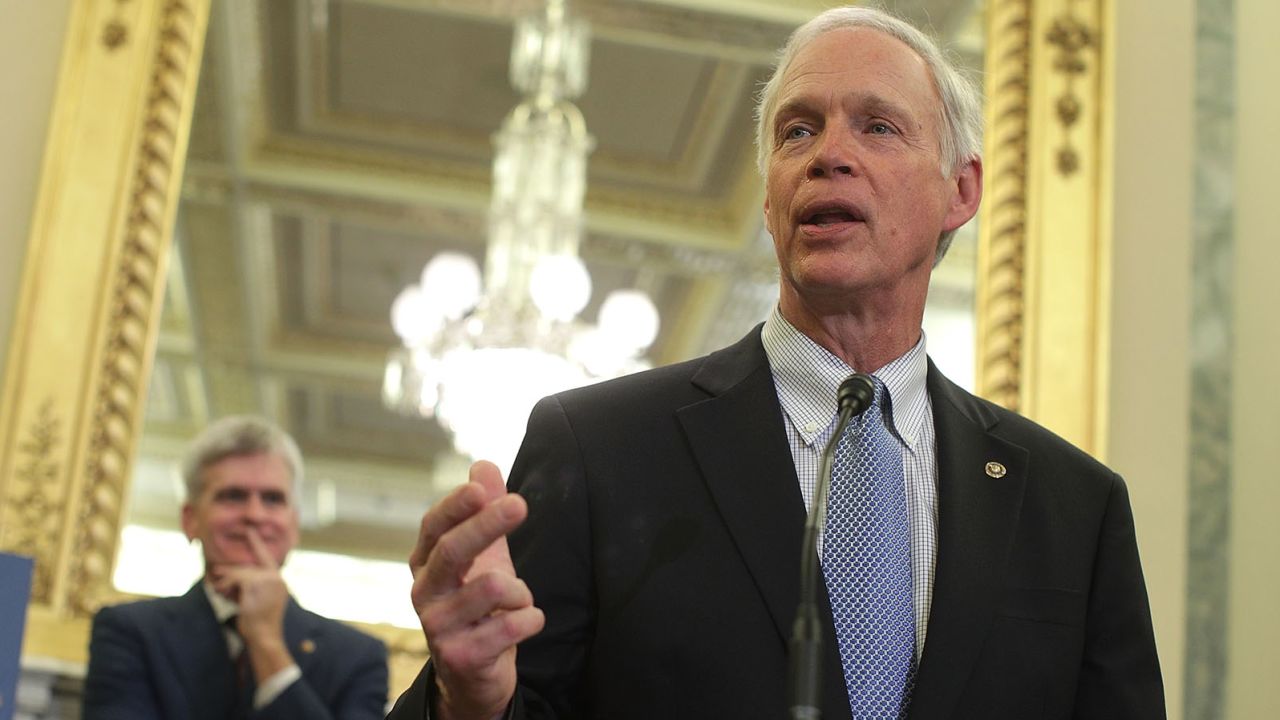 Sen. Ron Johnson (R-WI) (R) speaks as Sen. Bill Cassidy (R-LA) (L) listens during a news conference on health care September 13, 2017 on Capitol Hill in Washington, DC.